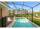 Private screened pool with a spacious deck for lounging at 8958 Sugar Palm Rd, Kissimmee, FL 34747