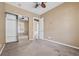 Bedroom with mirrored closet and ceiling fan at 12021 Jewel Fish Ln, Orlando, FL 32827