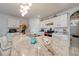 Spacious kitchen featuring white cabinets and a large island at 1242 Iguana Loop, Davenport, FL 33897