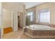 Elegant bathroom with soaking tub, walk-in shower, and double vanity at 1280 Osprey Landing Dr, Lakeland, FL 33813