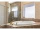 Bathroom features a large soaking tub and walk-in shower at 1280 Osprey Landing Dr, Lakeland, FL 33813
