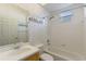 Simple bathroom with a shower/tub combo and floral wallpaper at 1280 Osprey Landing Dr, Lakeland, FL 33813