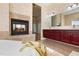 Bathroom with a large soaking tub, double vanity, and fireplace at 1280 Osprey Landing Dr, Lakeland, FL 33813