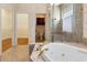 Bathroom features a large soaking tub, walk-in shower, and a separate toilet area at 1280 Osprey Landing Dr, Lakeland, FL 33813