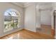 Dining room with hardwood floors and an arched window at 1280 Osprey Landing Dr, Lakeland, FL 33813