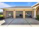Three car garage featuring high ceilings and overhead storage at 1280 Osprey Landing Dr, Lakeland, FL 33813