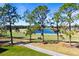 Golf course with pond and lush landscaping at 1280 Osprey Landing Dr, Lakeland, FL 33813
