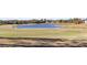 Peaceful golf course view with a pond at 1280 Osprey Landing Dr, Lakeland, FL 33813