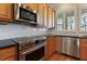 Kitchen with stainless steel appliances and wood cabinets at 1280 Osprey Landing Dr, Lakeland, FL 33813