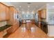 Open kitchen with an island, stainless steel appliances, and hardwood floors at 1280 Osprey Landing Dr, Lakeland, FL 33813