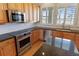 Modern kitchen with stainless steel appliances and granite countertops at 1280 Osprey Landing Dr, Lakeland, FL 33813
