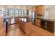 Large kitchen with island, stainless steel appliances, and hardwood floors at 1280 Osprey Landing Dr, Lakeland, FL 33813
