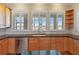Kitchen features granite countertops and a large sink with a view at 1280 Osprey Landing Dr, Lakeland, FL 33813