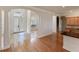 Open living area with hardwood floors and access to kitchen at 1280 Osprey Landing Dr, Lakeland, FL 33813