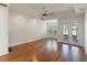 Main bedroom with hardwood floors and access to backyard at 1280 Osprey Landing Dr, Lakeland, FL 33813