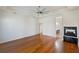 Main bedroom with hardwood floors, fireplace, and ensuite bathroom at 1280 Osprey Landing Dr, Lakeland, FL 33813
