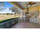 Outdoor kitchen with granite countertops and stainless steel appliances at 1280 Osprey Landing Dr, Lakeland, FL 33813