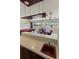 Wet bar with sink, mini-fridge, and wood cabinets at 1280 Osprey Landing Dr, Lakeland, FL 33813