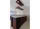 Modern wet bar with mini fridge and hanging rack at 1280 Osprey Landing Dr, Lakeland, FL 33813