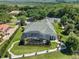 Luxury home with pool and spa, surrounded by lush landscaping and a tennis court at 1501 Sunset Pointe Pl, Kissimmee, FL 34744