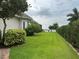 Large grassy backyard with lake view at 1501 Sunset Pointe Pl, Kissimmee, FL 34744