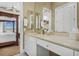 Bathroom with a single vanity and a large mirror at 1501 Sunset Pointe Pl, Kissimmee, FL 34744