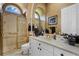 Elegant bathroom with a shower, vanity, and gold accents at 1501 Sunset Pointe Pl, Kissimmee, FL 34744