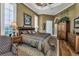 Elegant Primary bedroom with a large bed and plenty of natural light at 1501 Sunset Pointe Pl, Kissimmee, FL 34744