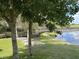 Peaceful lakeside boardwalk path surrounded by lush greenery at 1501 Sunset Pointe Pl, Kissimmee, FL 34744