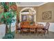 Formal dining room with large table and chandelier at 1501 Sunset Pointe Pl, Kissimmee, FL 34744