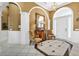 Elegant entryway with wood furniture and tile floors at 1501 Sunset Pointe Pl, Kissimmee, FL 34744