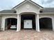 Spacious three-car garage with storage at 1501 Sunset Pointe Pl, Kissimmee, FL 34744