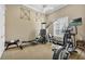 Well-equipped home gym featuring various exercise machines at 1501 Sunset Pointe Pl, Kissimmee, FL 34744