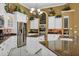 Modern kitchen with white cabinets, granite countertops, and double ovens at 1501 Sunset Pointe Pl, Kissimmee, FL 34744