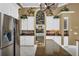 Elegant kitchen boasting granite countertops and stainless steel appliances at 1501 Sunset Pointe Pl, Kissimmee, FL 34744