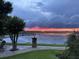 Dramatic sunset view over the lake at 1501 Sunset Pointe Pl, Kissimmee, FL 34744