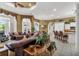 Open living area with leather furniture and a view into the kitchen at 1501 Sunset Pointe Pl, Kissimmee, FL 34744