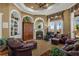 Relaxing living room featuring a fireplace and built-in shelving at 1501 Sunset Pointe Pl, Kissimmee, FL 34744