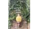 Entrance sign for Brownie Wise Park, featuring brick pillars and a vintage lamp at 1501 Sunset Pointe Pl, Kissimmee, FL 34744