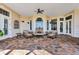 Spacious covered patio with comfortable seating at 1501 Sunset Pointe Pl, Kissimmee, FL 34744