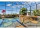 Relaxing screened pool and spa with stonework and fountain at 1501 Sunset Pointe Pl, Kissimmee, FL 34744