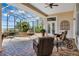 Relaxing covered patio overlooking a refreshing pool at 1501 Sunset Pointe Pl, Kissimmee, FL 34744