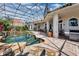 Large, screened pool and patio with outdoor kitchen area at 1501 Sunset Pointe Pl, Kissimmee, FL 34744