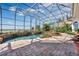 Expansive screened pool with gorgeous lake views at 1501 Sunset Pointe Pl, Kissimmee, FL 34744