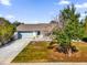 Newly renovated home with a gray roof and updated facade at 1538 N Normandy Blvd, Deltona, FL 32725