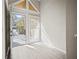 Sunlit entryway with view of backyard deck and access to exterior at 1621 Ne 2Nd St # 203, Ocala, FL 34470