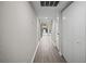 Light-filled hallway with wood-look floors and access to backyard patio at 1621 Ne 2Nd St # 203, Ocala, FL 34470