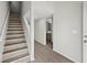 Modern staircase with light wood laminate treads at 1621 Ne 2Nd St # 203, Ocala, FL 34470