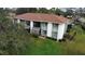 Aerial view of condo building showing landscaping and parking at 2 Buck Cir # 2, Haines City, FL 33844