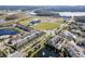Aerial view of community with lake, pool, and townhomes at 9475 Randal Park Blvd, Orlando, FL 32832